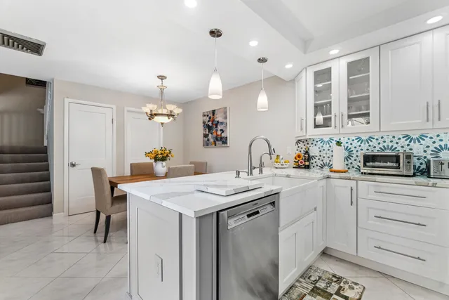 a kitchen with a sink and cabinets