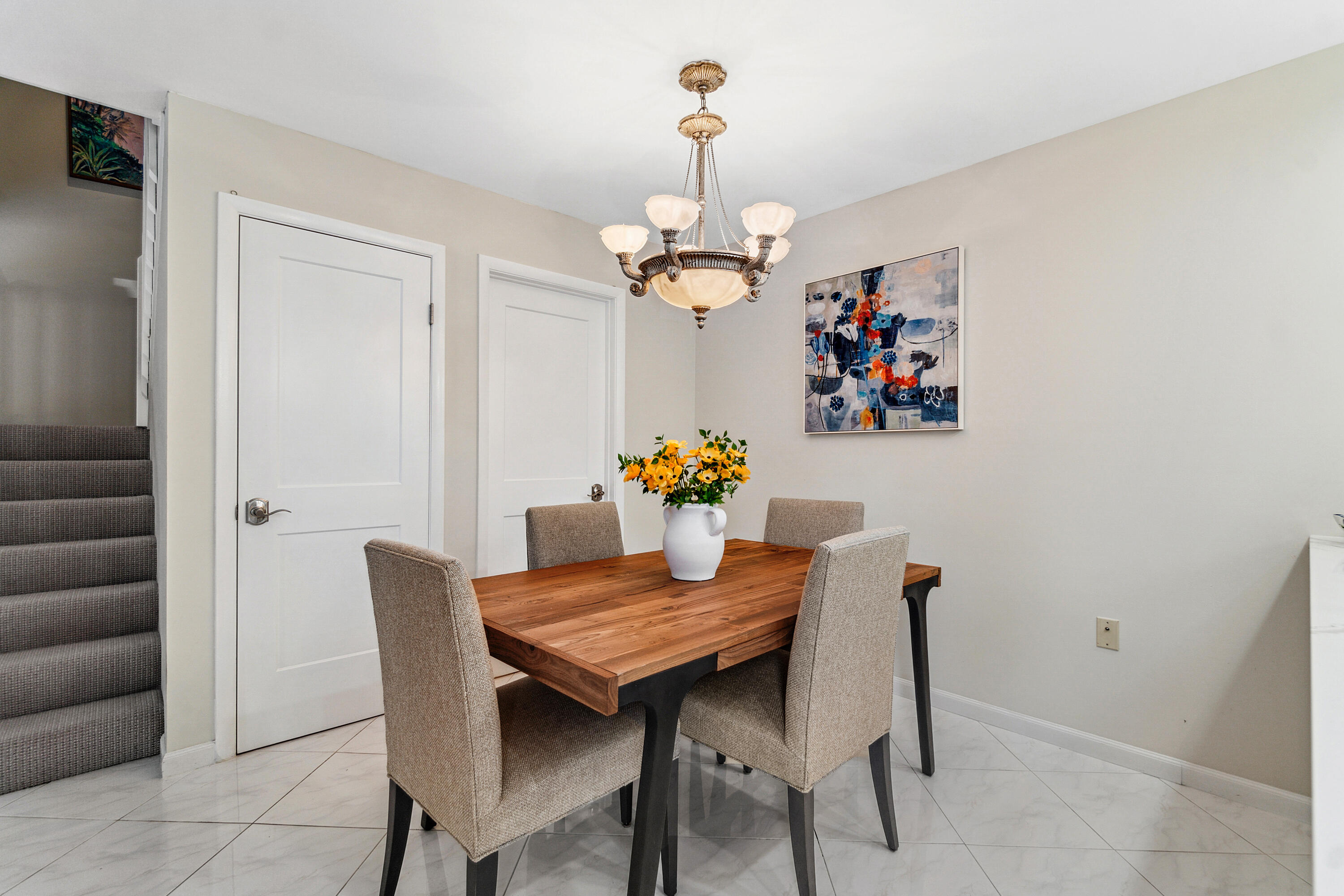 2906 29th Court Jupiter, FL 33477 - Photo 16 of 31 a dining room with furniture and wooden floor