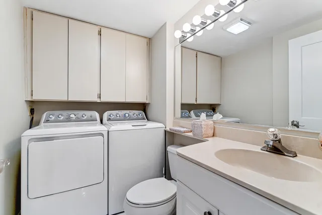 a view of bathroom with a washer and dryer