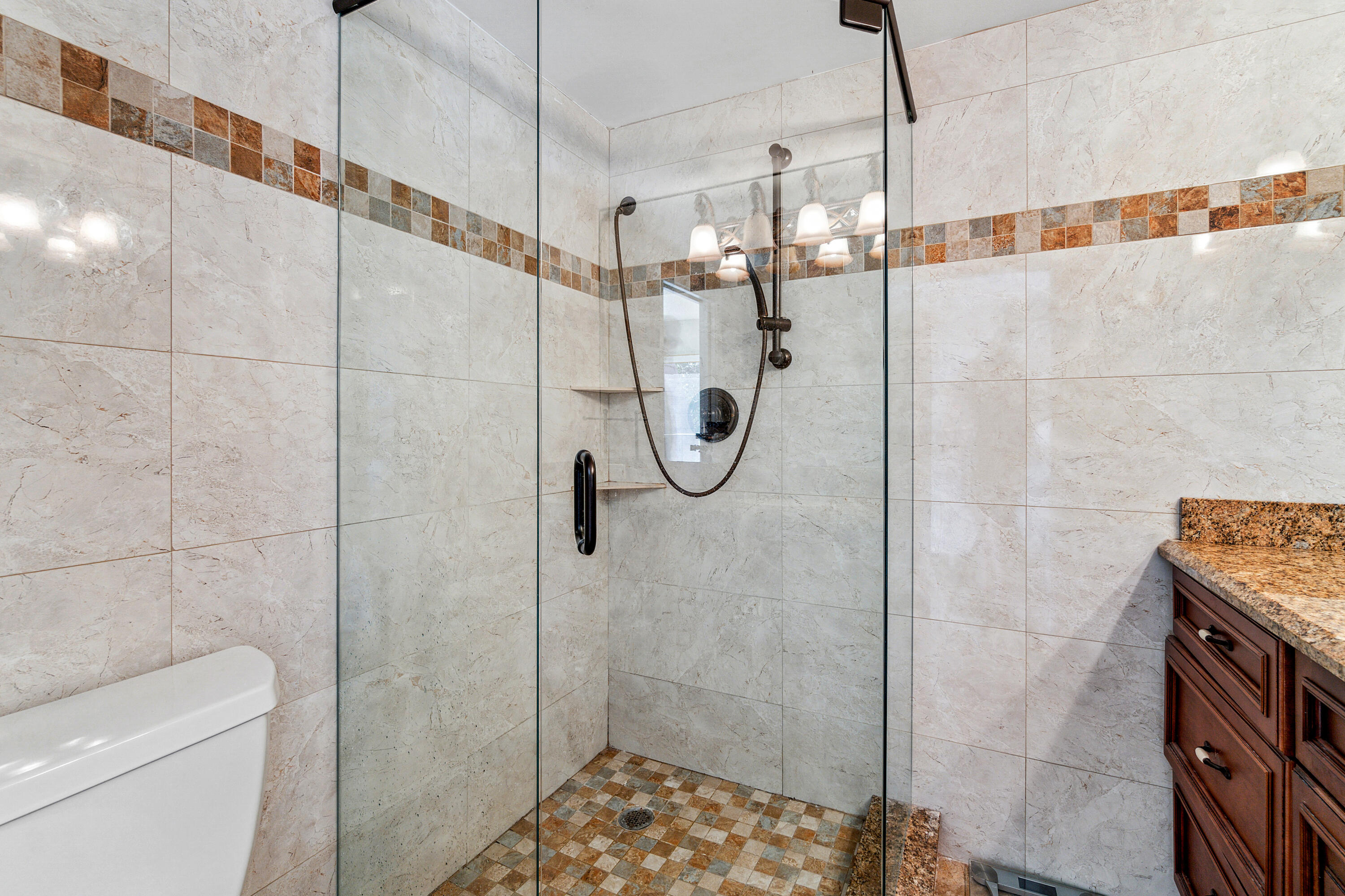 2906 29th Court Jupiter, FL 33477 - Photo 22 of 31 a bathroom with a shower and toilet