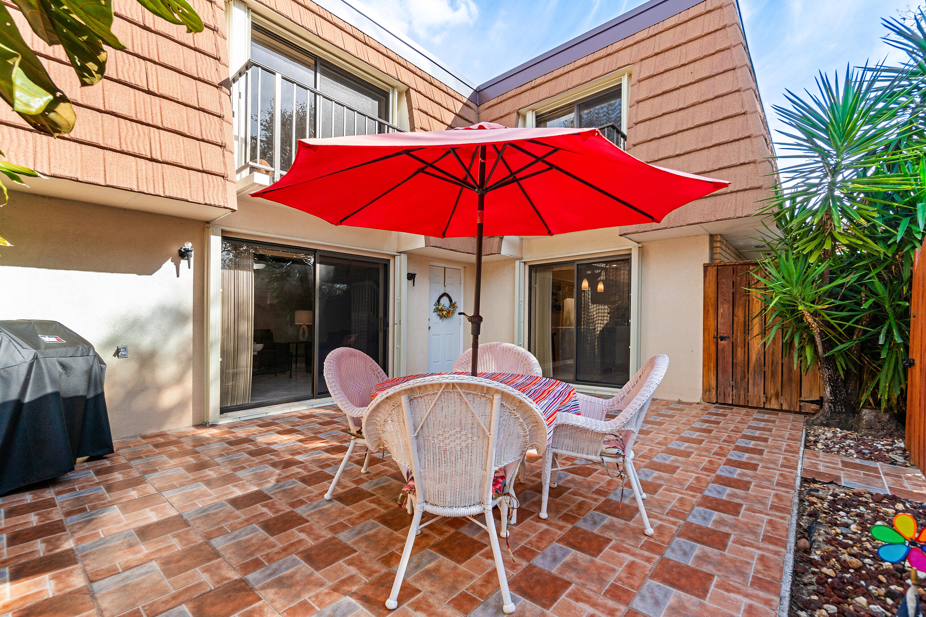 2906 29th Court Jupiter, FL 33477 - Photo 6 of 31 a view of a house with a patio