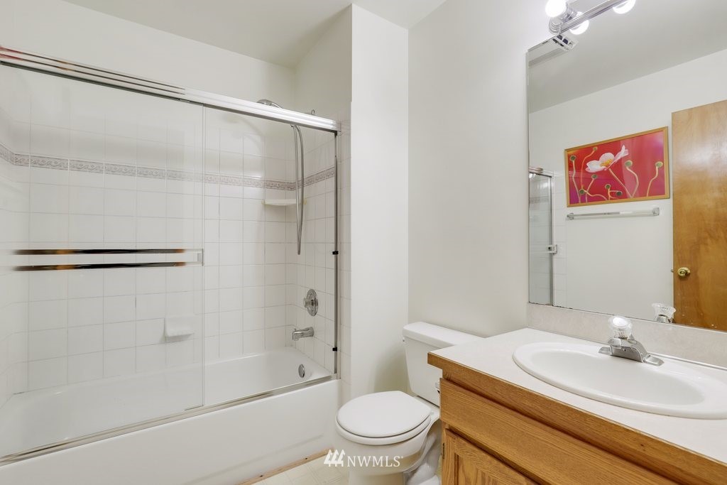 9641 South 194th Street Renton, WA 98055 - Photo 23 of 29 a bathroom with a sink a toilet and shower