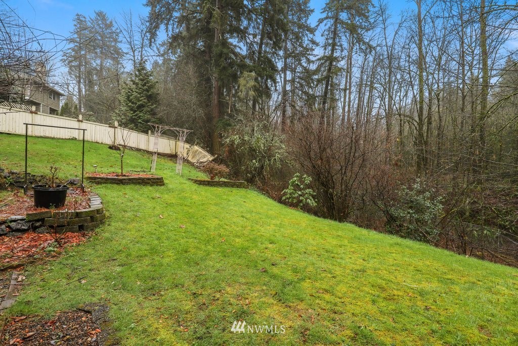 9641 South 194th Street Renton, WA 98055 - Photo 27 of 29 a view of a backyard with a slide