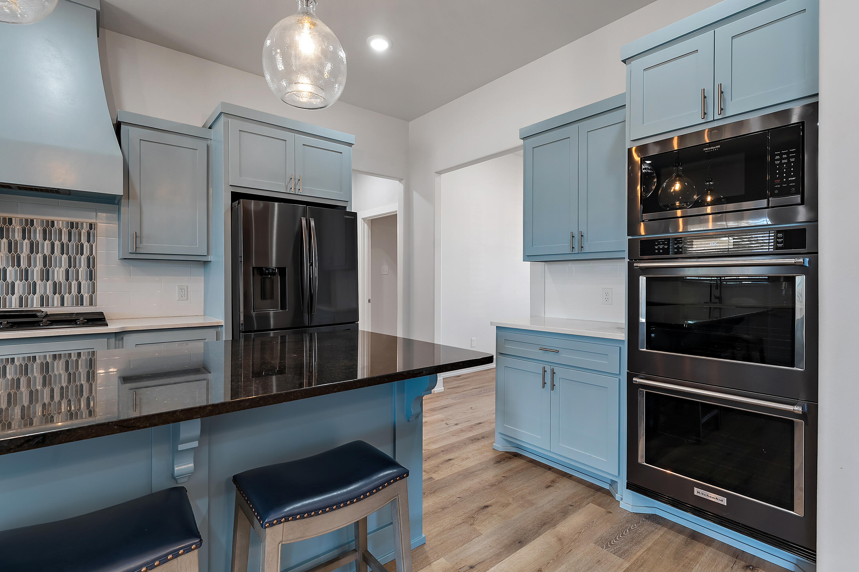 9217 County Road 6870 Lubbock, TX 79407 - Photo 12 of 39 a kitchen with stainless steel appliances a stove microwave and a refrigerator