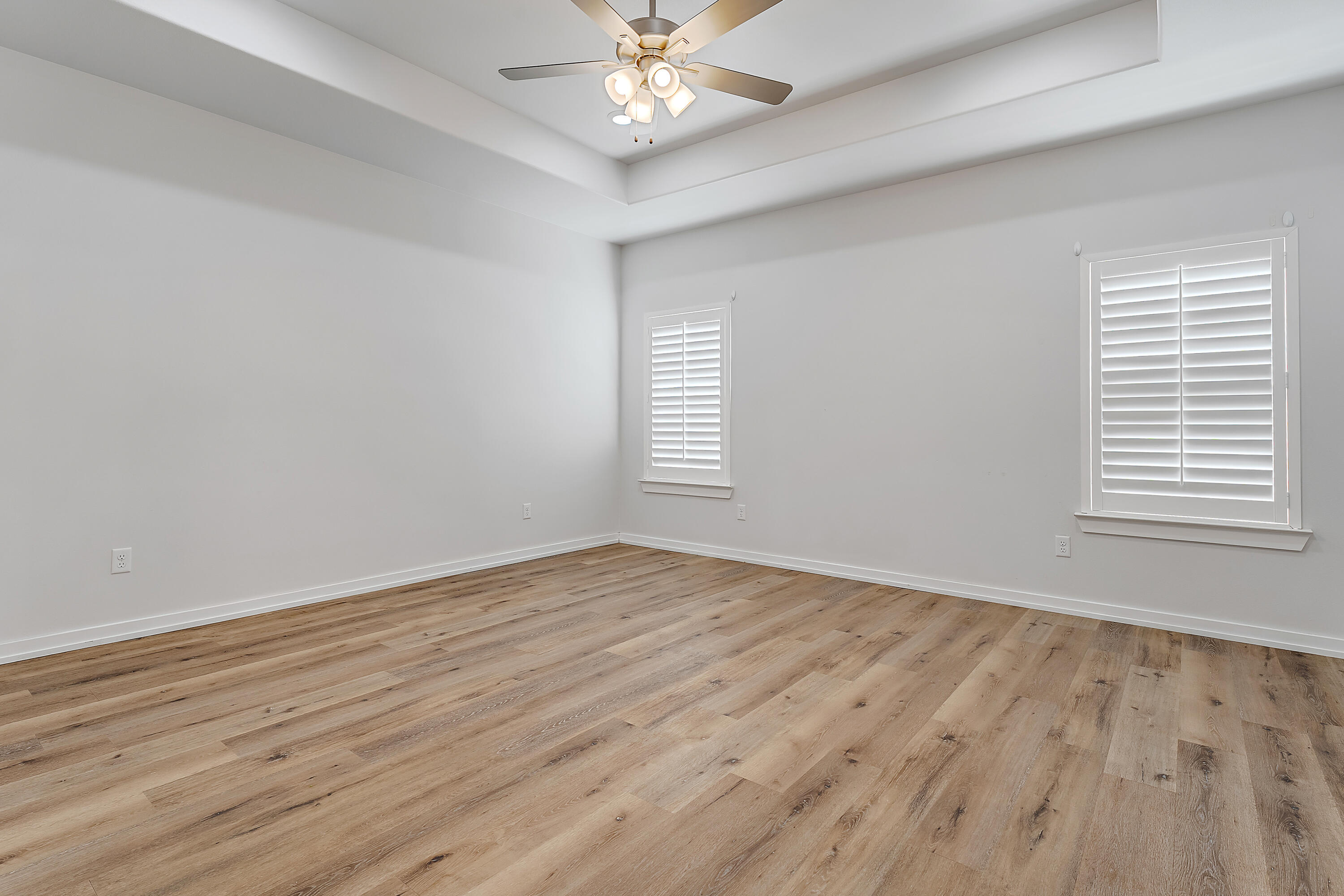 9217 County Road 6870 Lubbock, TX 79407 - Photo 16 of 39 a view of an empty room with wooden floor and a window