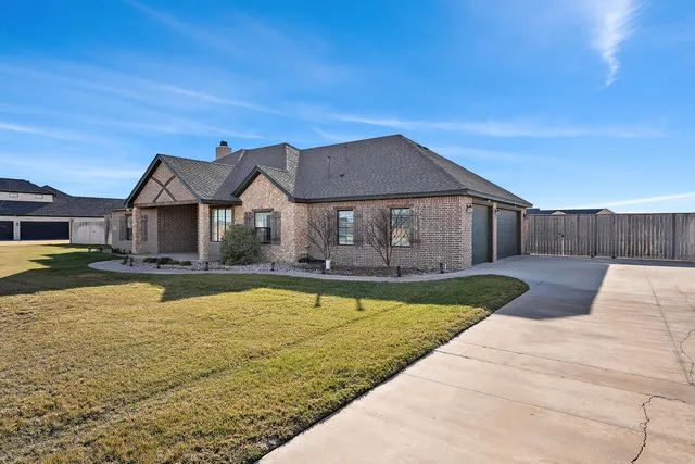 a kitchen with kitchen island stainless steel appliances a sink stove and cabinets