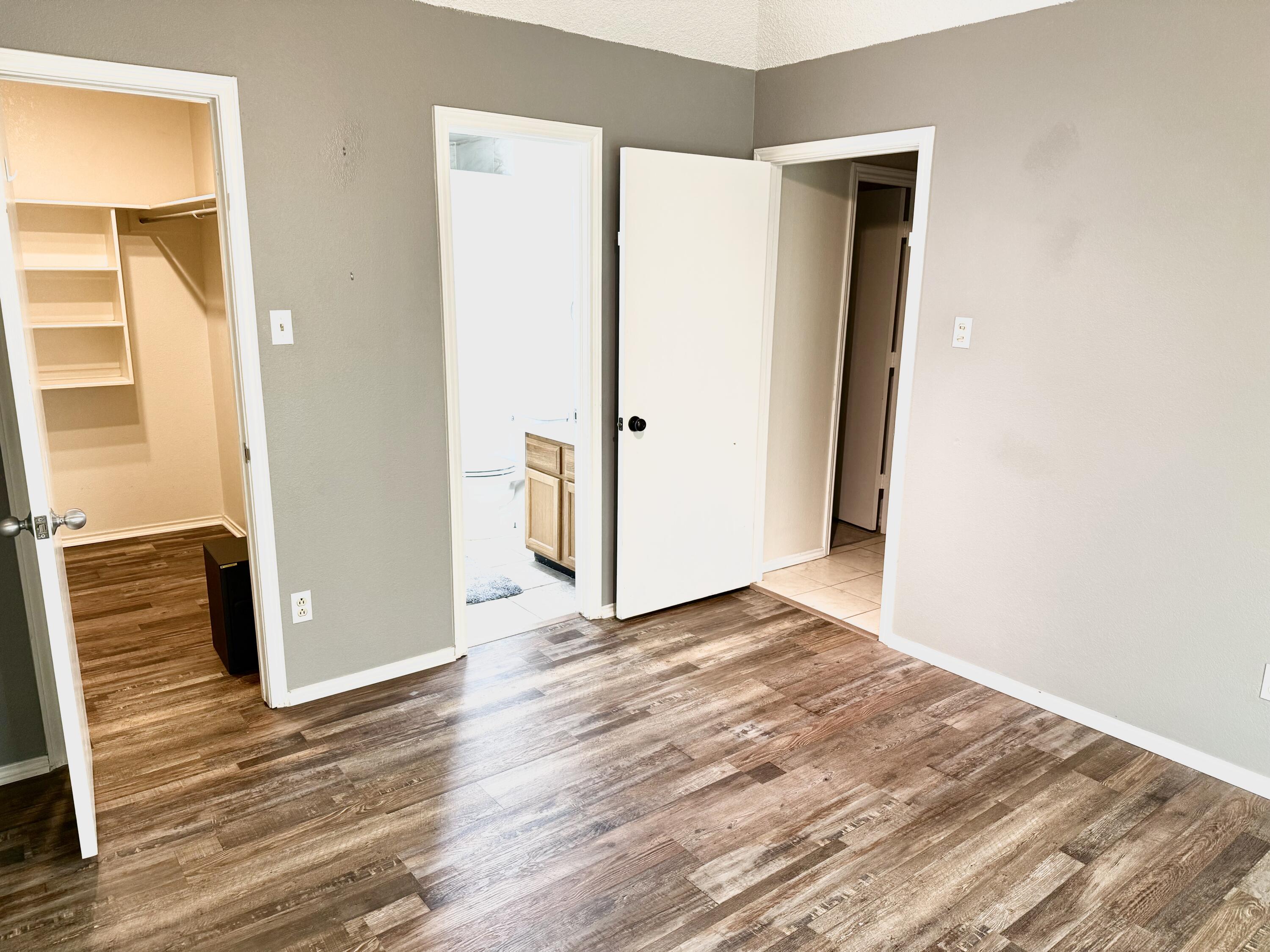 9217 County Road 6870 Lubbock, TX 79407 - Photo 38 of 39 a view of an empty room with wooden floor and a window