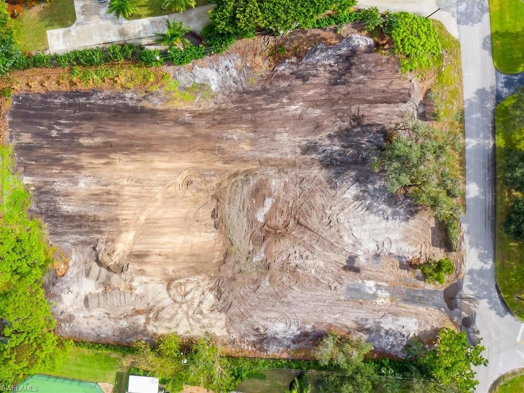 107 Myrtle Road Naples, FL 34108 - Photo 2 of 11 a backyard of a house with lots of green space