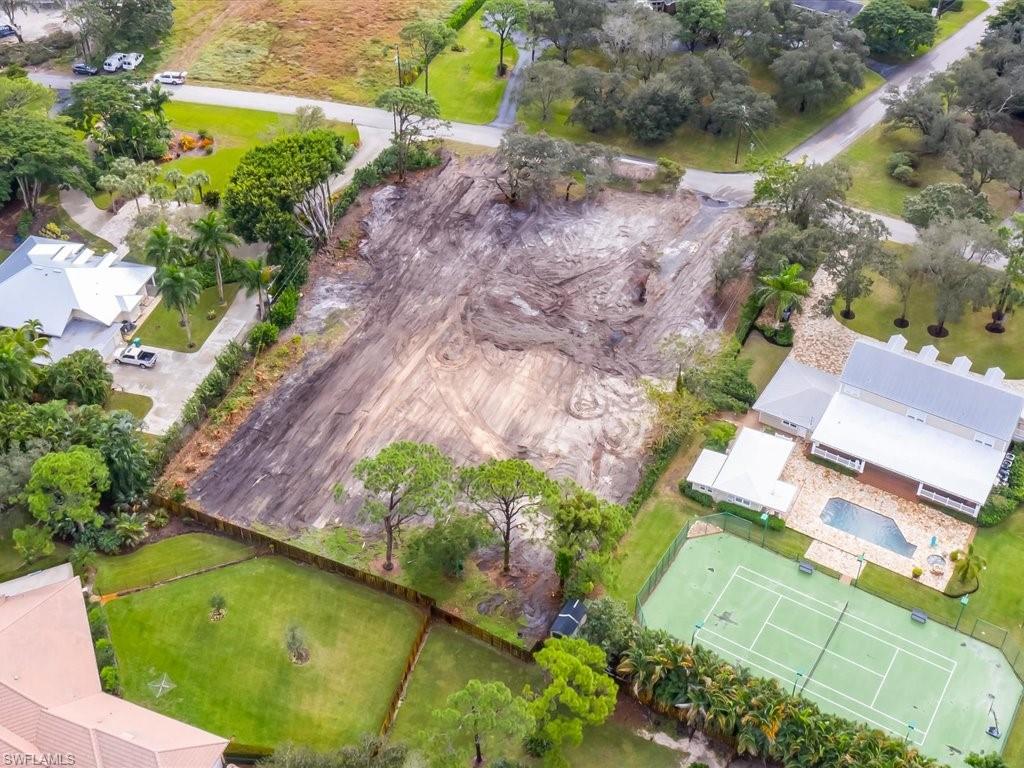 107 Myrtle Road Naples, FL 34108 - Photo 3 of 11 an aerial view of a house with a yard and lake view