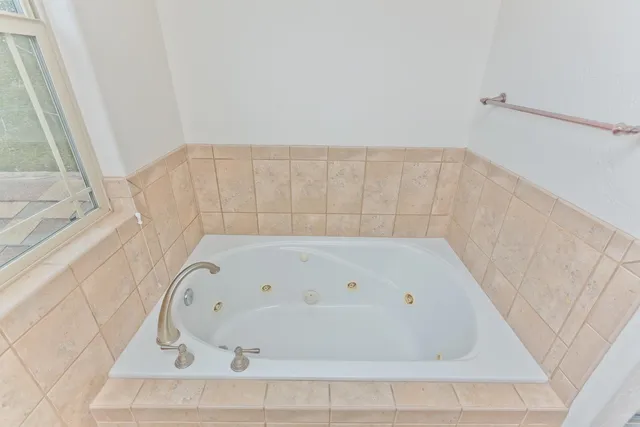 a bathroom with a sink vanity granite and a mirror
