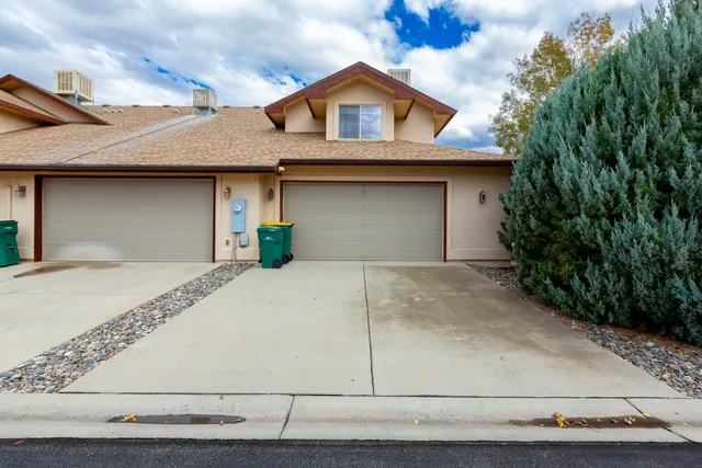 a view of a car park in front of a house