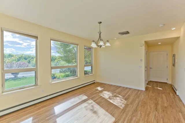 a view of livingroom with hardwood floor and ceiling fan