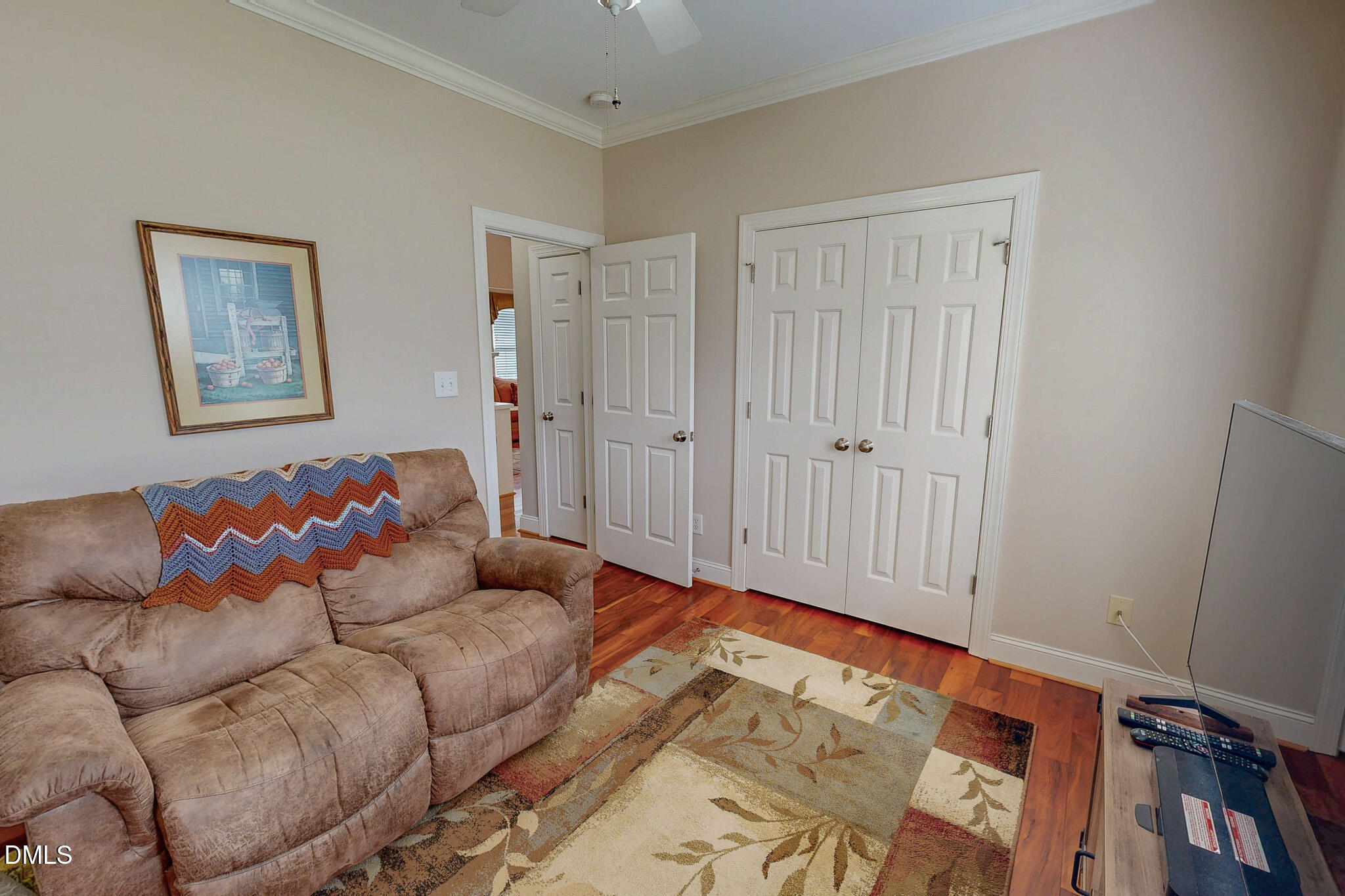 115 Duncan Plantation Road Timberlake, NC 27583 - Photo 38 of 48 a living room with furniture and a wooden floor