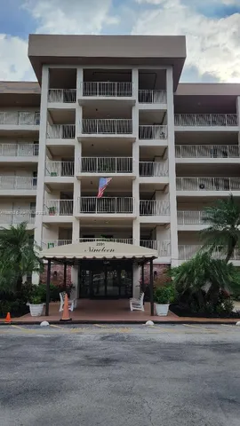 a front view of a building with a street