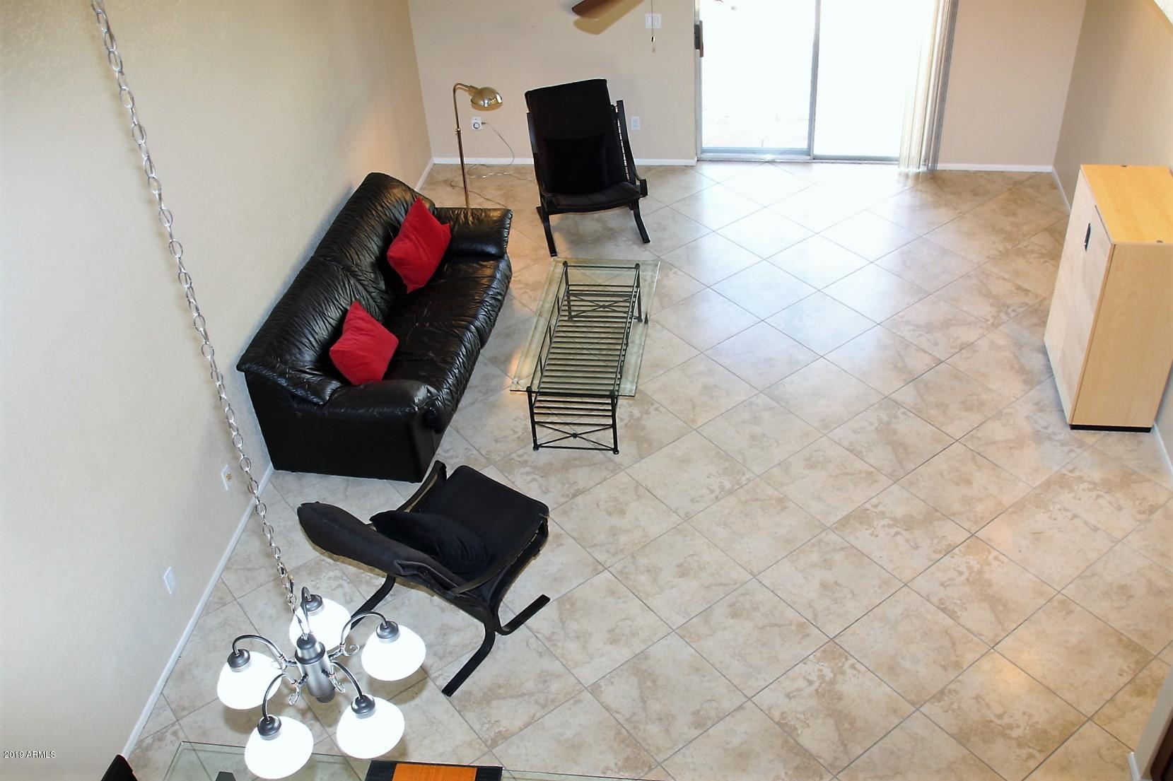11615 North 40th Way Phoenix, AZ 85028 - Photo 18 of 33 a living room with furniture and wooden floor
