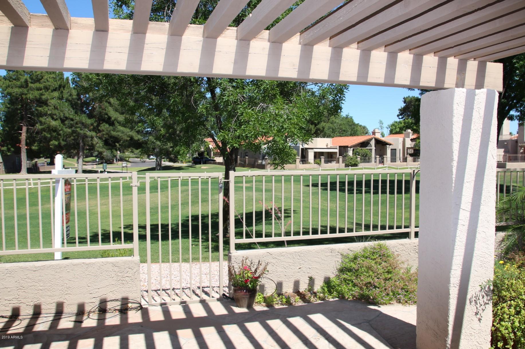11615 North 40th Way Phoenix, AZ 85028 - Photo 31 of 33 a view of a deck with a big yard and plants