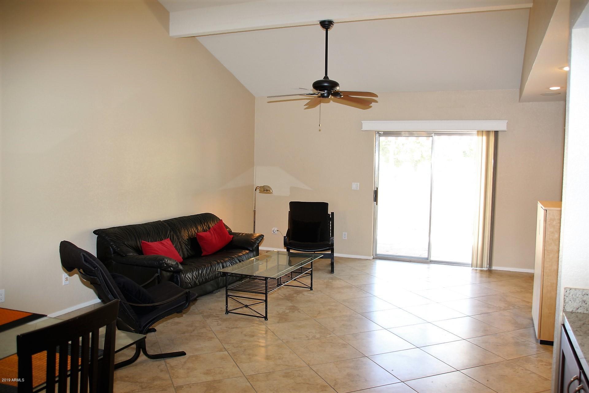 11615 North 40th Way Phoenix, AZ 85028 - Photo 10 of 33 a living room with furniture and a flat screen tv