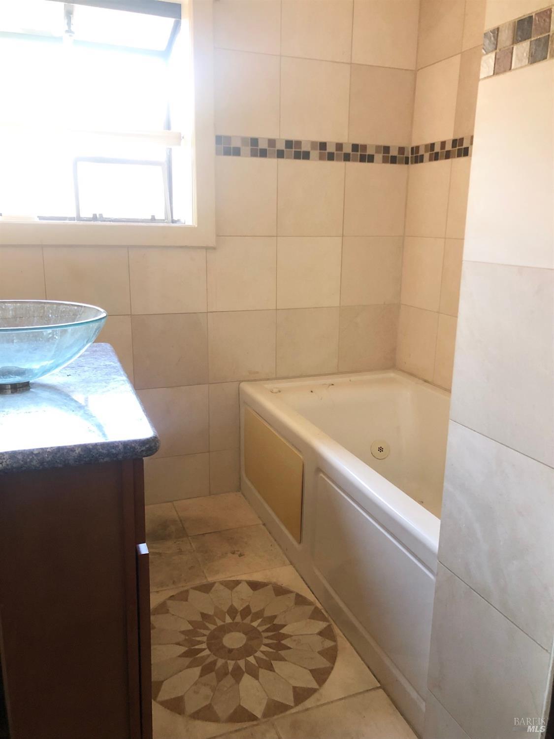 306 Marin Avenue Mill Valley, CA 94941 - Photo 13 of 26 a bathroom with a bathtub and shower