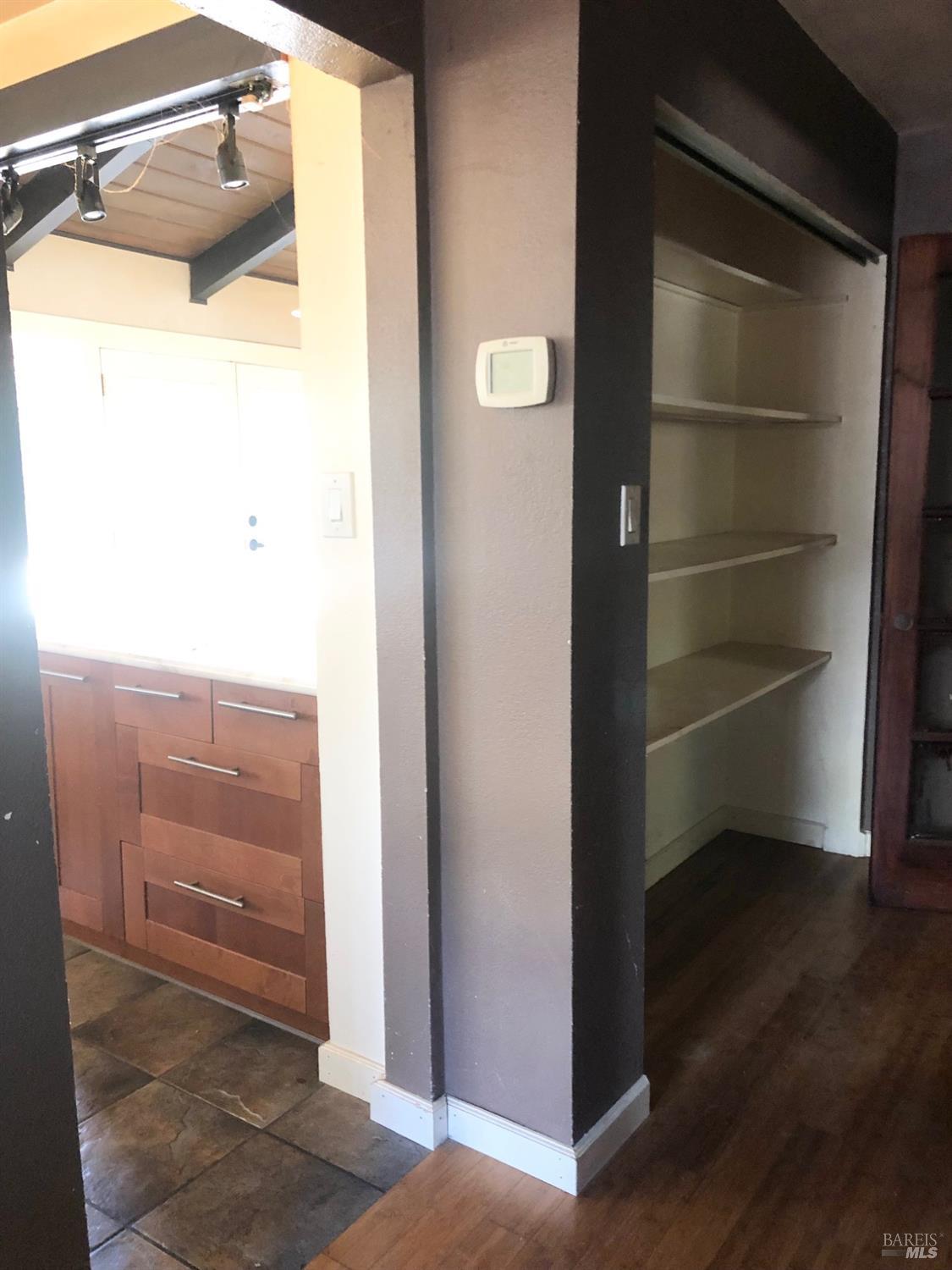 306 Marin Avenue Mill Valley, CA 94941 - Photo 17 of 26 a view of walk in closet with empty racks