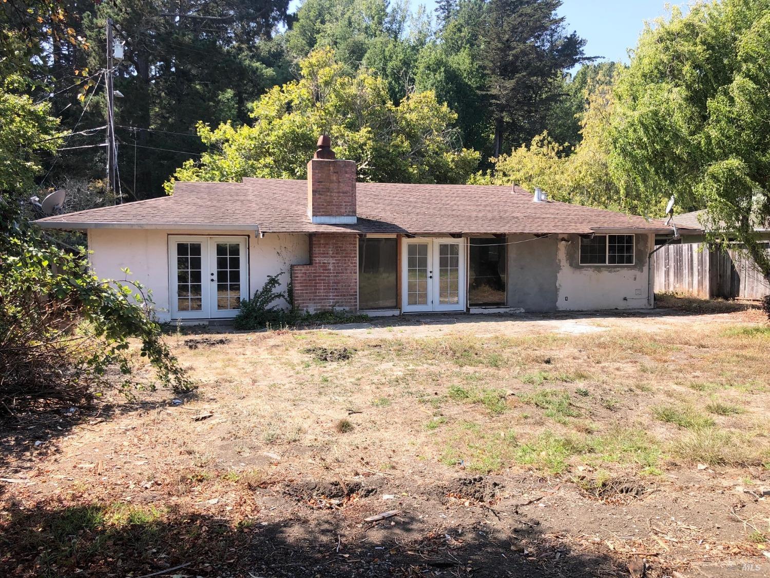 306 Marin Avenue Mill Valley, CA 94941 - Photo 2 of 26 a front view of a house with a yard covered with trees