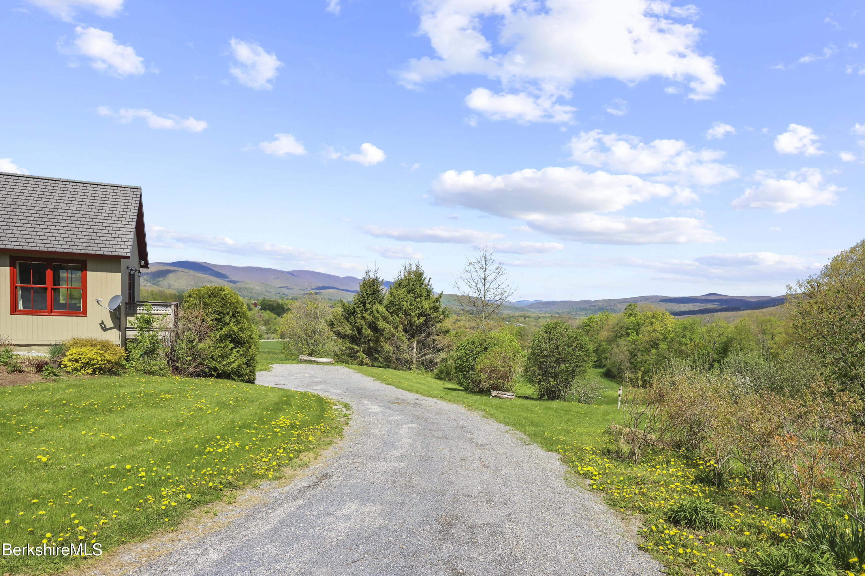 821 Pattison Road North Adams, MA 01247 - Photo 57 of 68 a view of a city with flower plants and wooden fence
