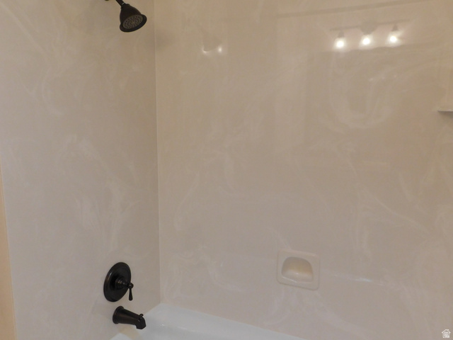 2148 Carolyn Way Bountiful, UT 84010 - Photo 10 of 40 Tub and shower combination featuring oil-rubbed bronze fixtures and a built-in soap dish
