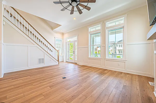 a living room with furniture fireplace and window