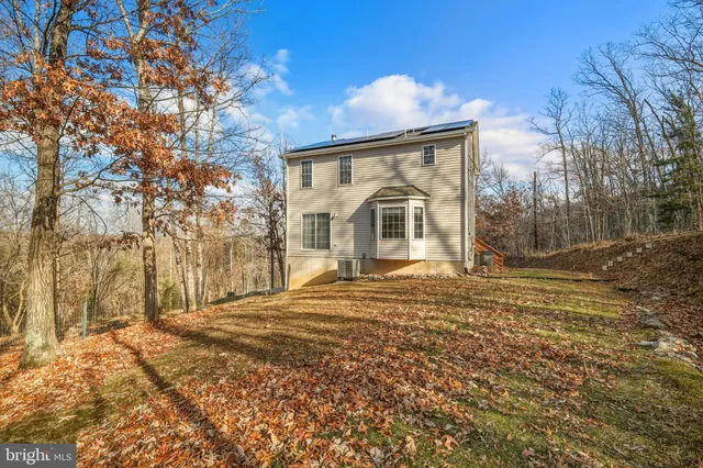 a view of front of house with a yard