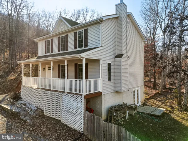 a view of a brick house with many windows