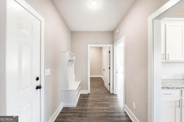 a view of a bathroom from a hallway