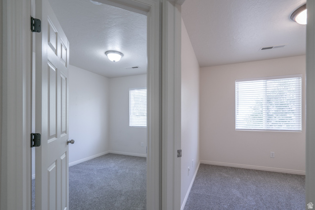 1735 West 540 North, Unit 1805 St. George, UT 84770 - Photo 55 of 64 Neutral palette interiors featuring clean walls, gray carpeting, recessed lighting, and window blinds