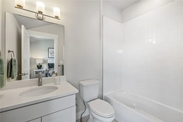 a bathroom with a toilet a sink and a bathtub