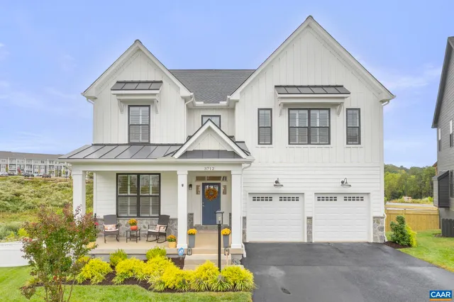 a view of multiple houses with a yard