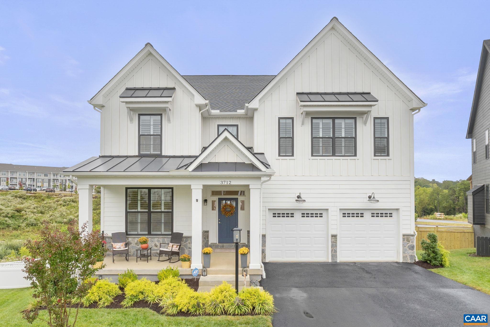 a view of multiple houses with a yard