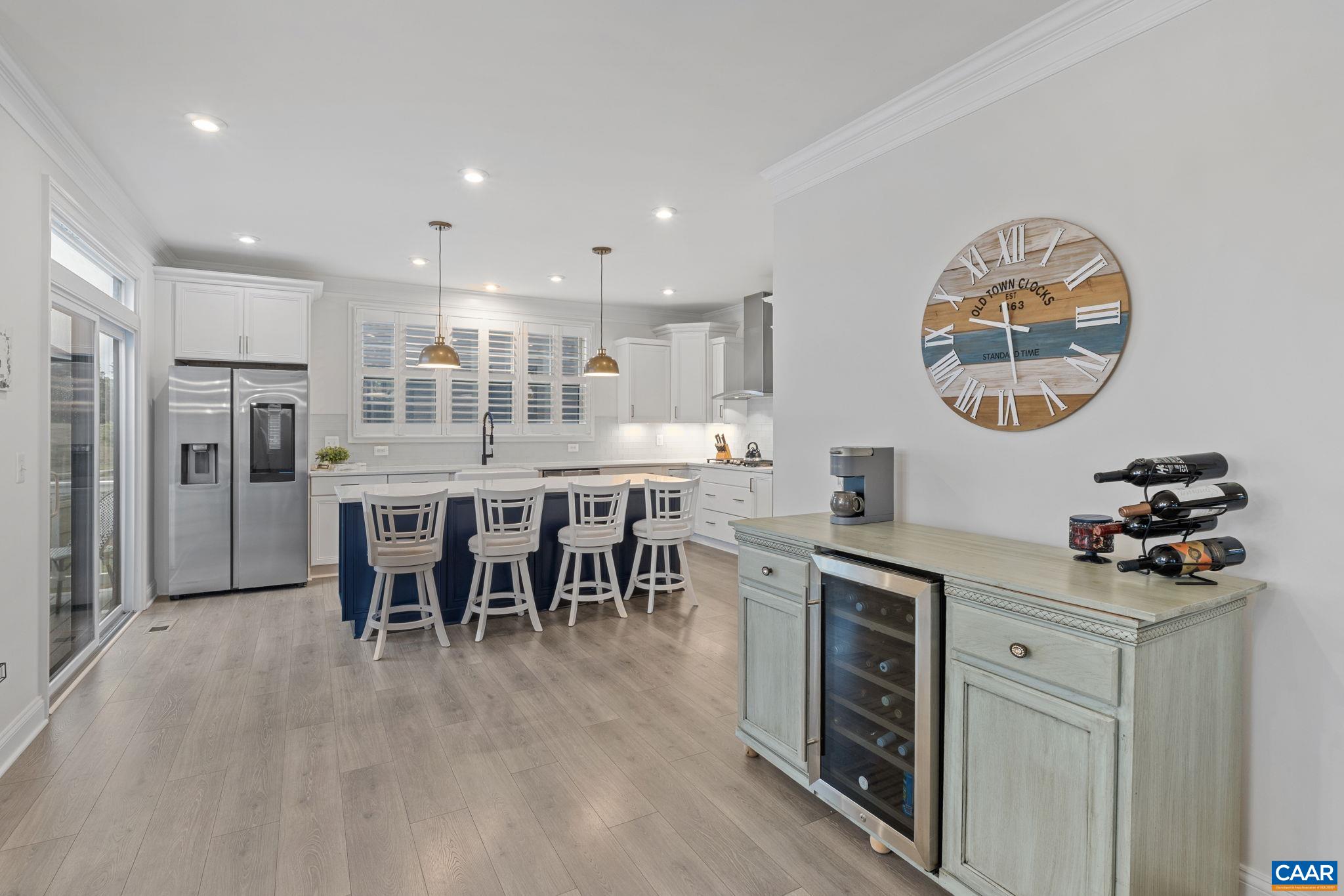 3712 Thicket Run Place Charlottesville, VA 22911 - Photo 16 of 73 a kitchen with stainless steel appliances granite countertop a stove and a dining table