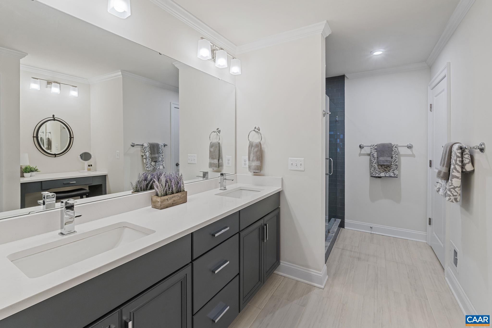 3712 Thicket Run Place Charlottesville, VA 22911 - Photo 29 of 73 a bathroom with a sink double vanity and a mirror