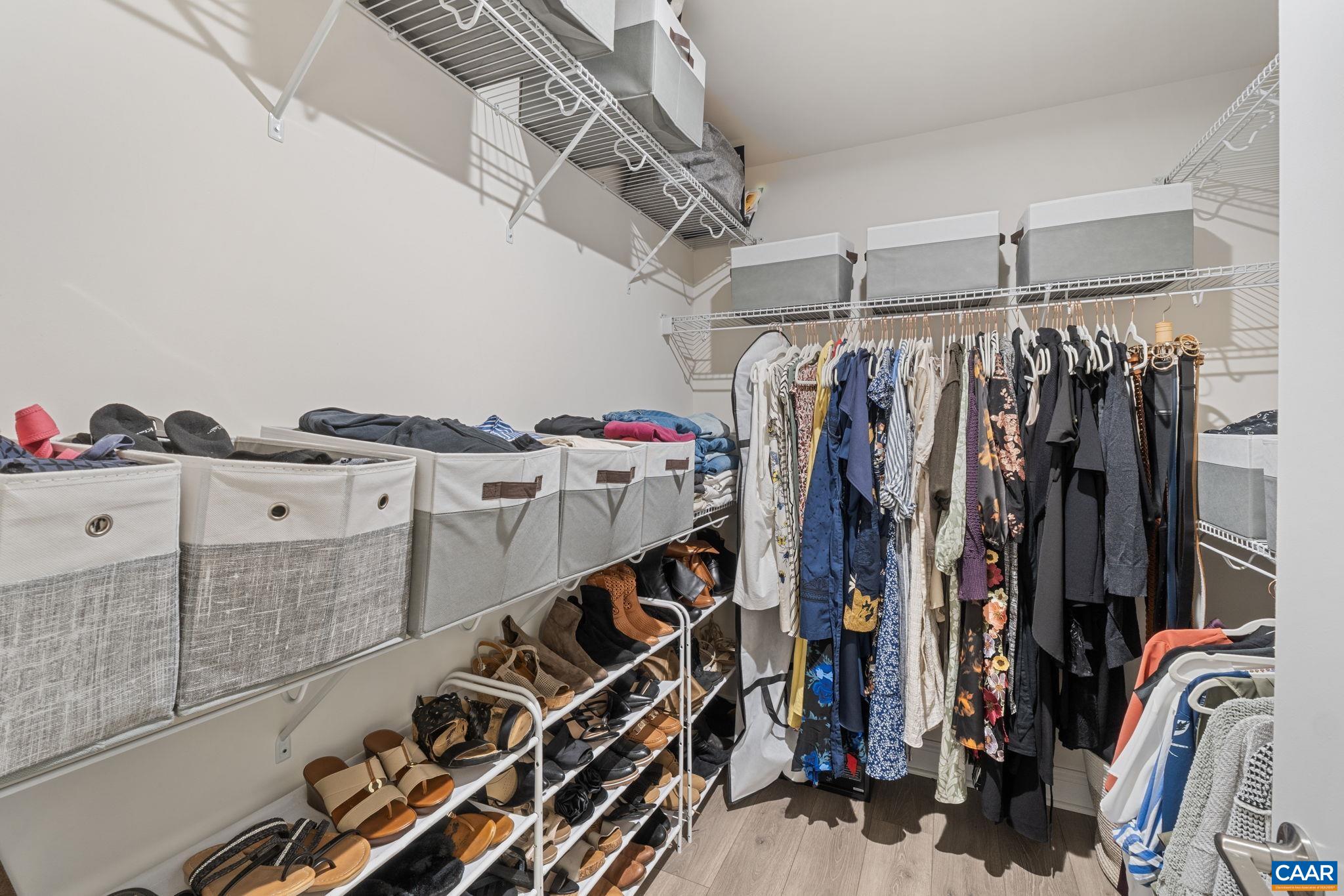 3712 Thicket Run Place Charlottesville, VA 22911 - Photo 32 of 73 a view of walk in closet with clothes and shoes
