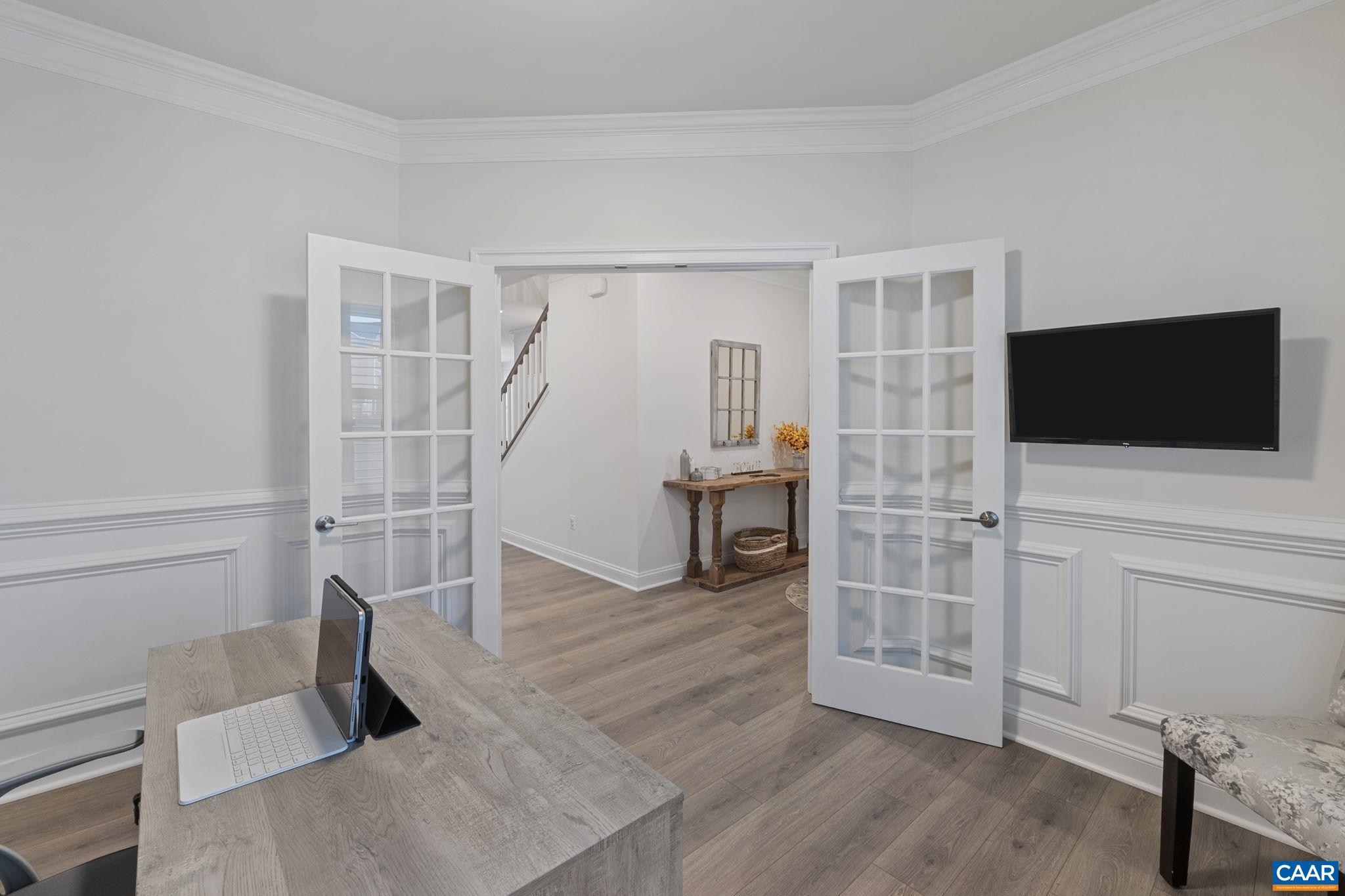 3712 Thicket Run Place Charlottesville, VA 22911 - Photo 8 of 73 a living room with furniture and a flat screen tv