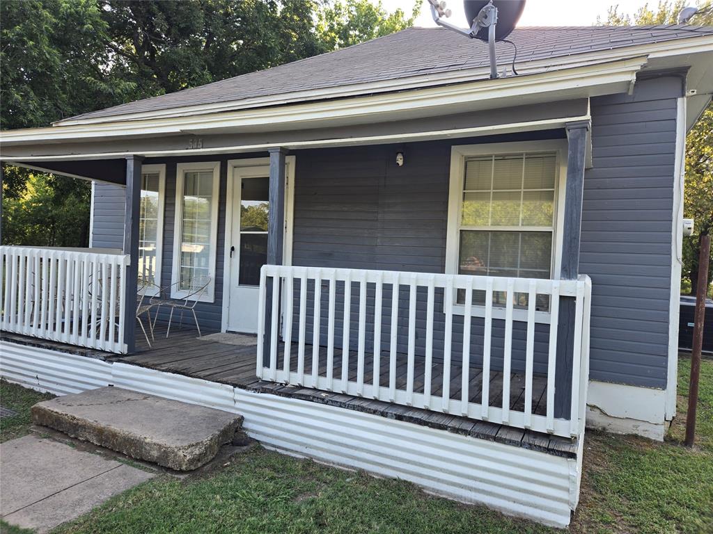 535 Hancock Street Gainesville, TX 76240 - Photo 1 of 22 a side view of a house with a porch