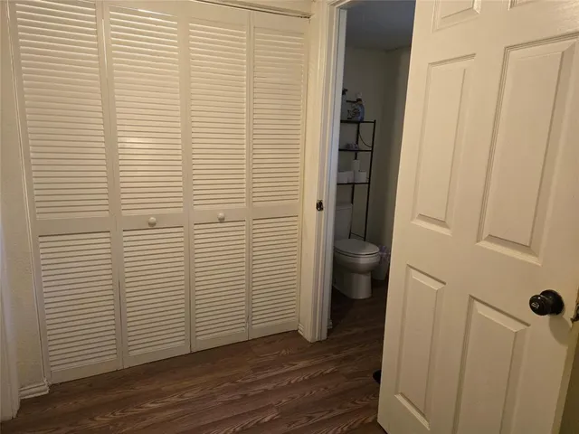 a view of a bathroom with wooden floor and a sink