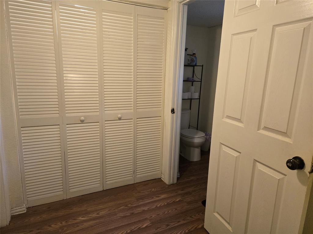 535 Hancock Street Gainesville, TX 76240 - Photo 12 of 22 a view of a bathroom with wooden floor and a sink