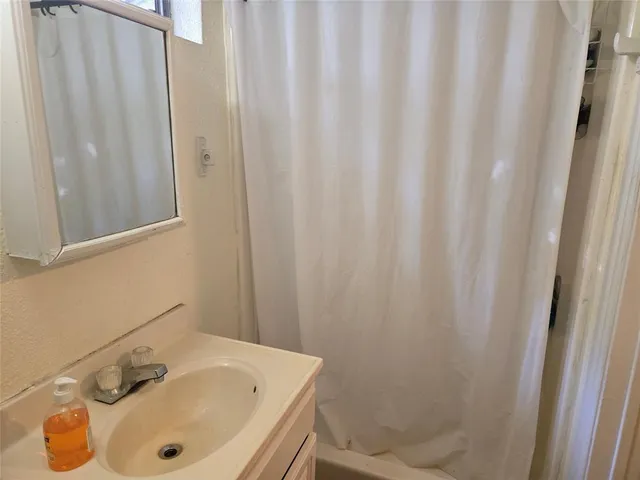 a bathroom with a sink and a tub