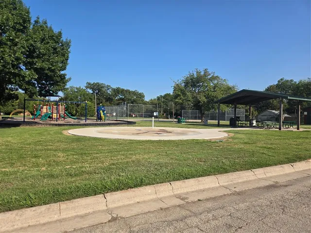 a view of a swimming pool and a yard