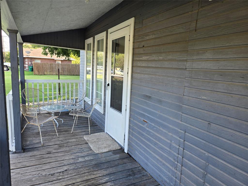 535 Hancock Street Gainesville, TX 76240 - Photo 4 of 22 a view of a room with wooden floor and furniture