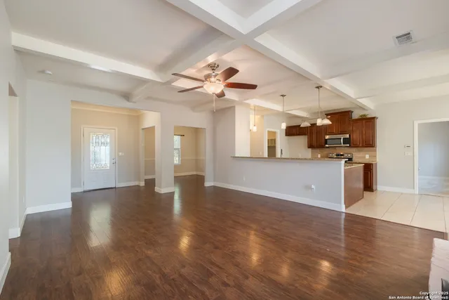 a bathroom with a granite countertop sink a washer and dryer