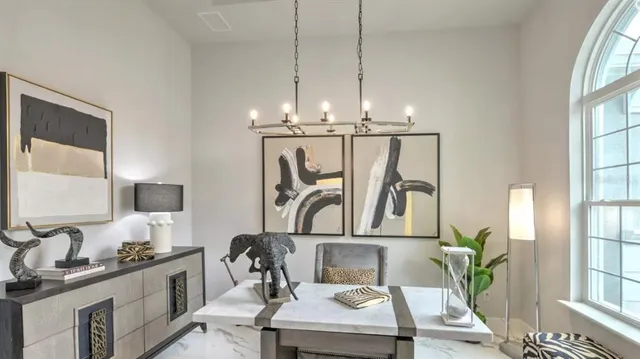 a very nice looking dining room with a table or chairs and a kitchen view