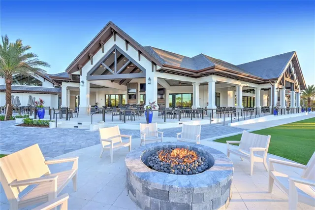 swimming pool view with a seating space