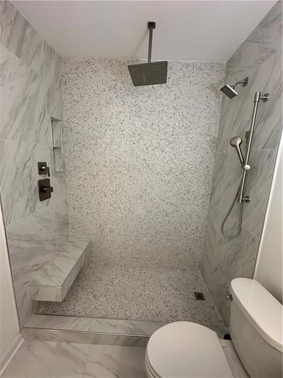 3823 Paces Ferry West Atlanta, GA 30339 - Photo 23 of 33 a bathroom with a toilet and a shower