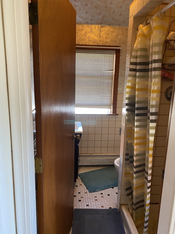 213 Holland Street, Unit R Somerville, MA 02144 - Photo 13 of 23 a bathroom with a sink and a shower