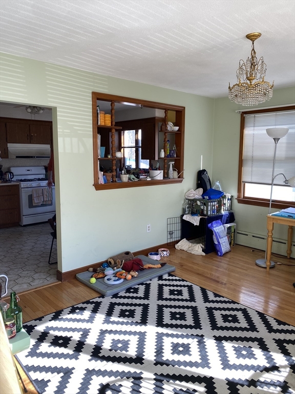 213 Holland Street, Unit R Somerville, MA 02144 - Photo 14 of 23 a room with furniture and a fireplace